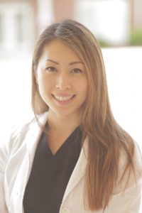 Woman in white coat